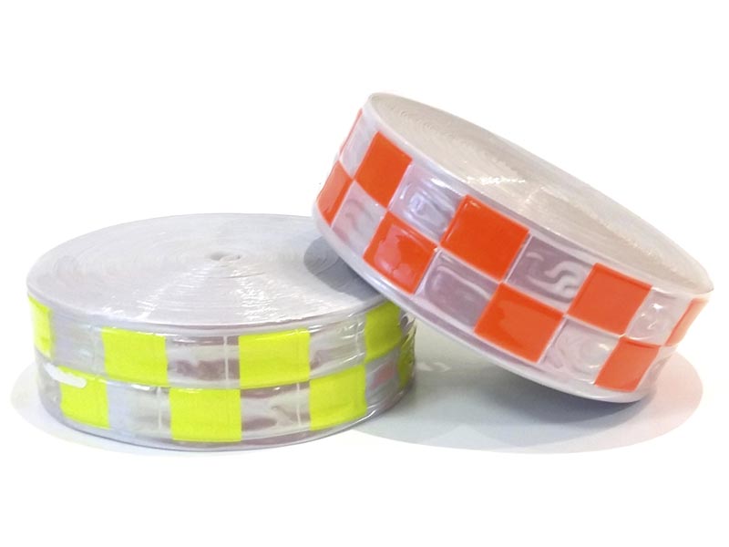 Cinta reflectiva p/coser plástica 5cm x 50mts.Cuadrados-Naranja/Blanca
